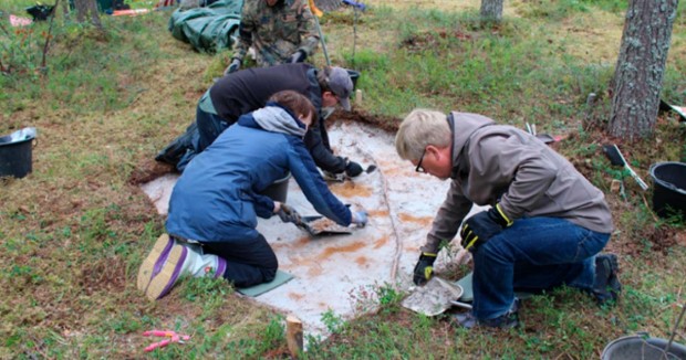 Archaeologists excavating at the site in Tainiaro forest, Finland. 